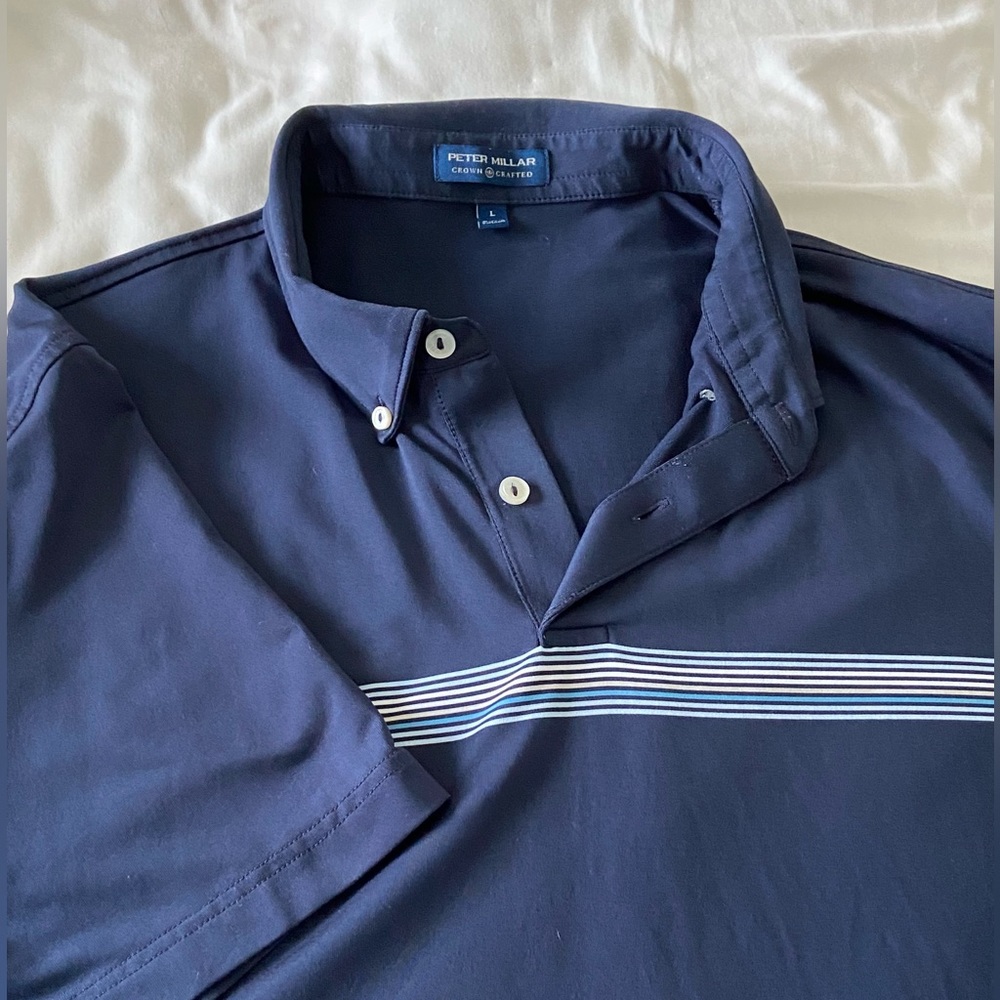 Peter Millar size L blue golf shirt with horizontal multi stripes across chest
